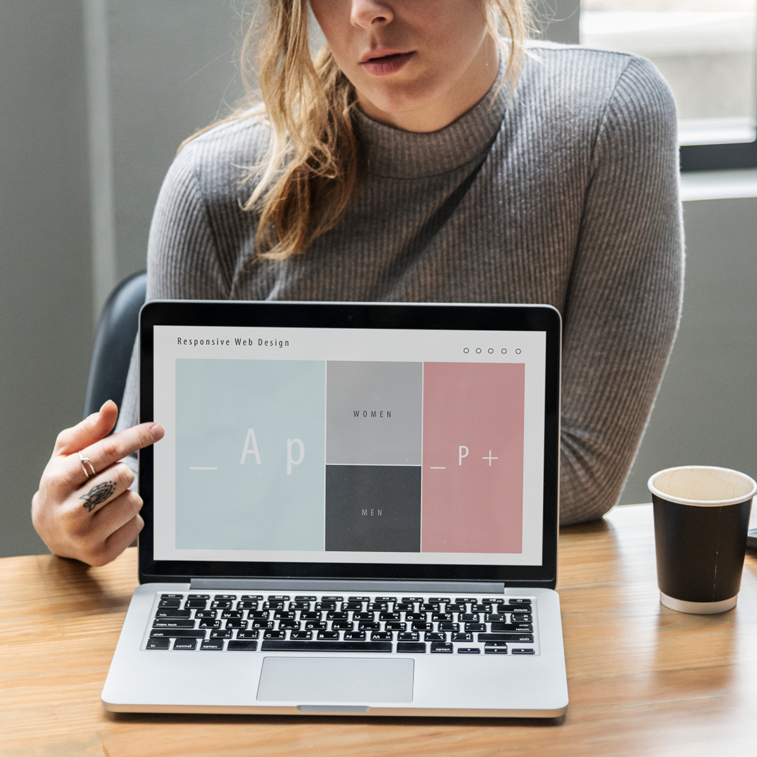 woman-pointing-on-the-laptop-screen-web-design-showing woman-pointing-on-the-laptop-screen-web-design-showing